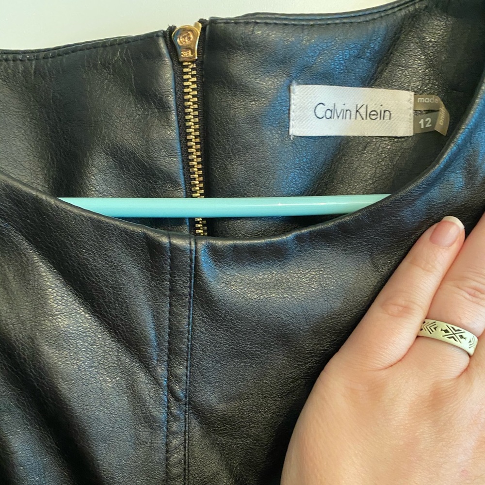 Fitted lace and leather little black dress